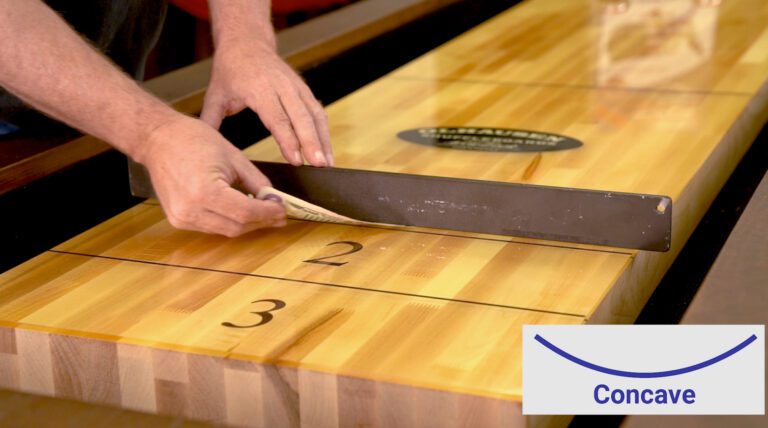 leveling a shuffleboard playing surface