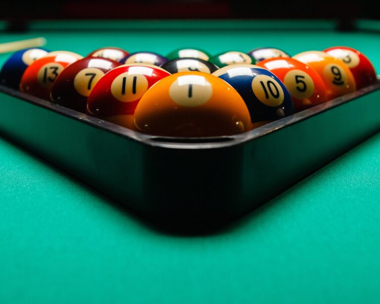 Billiard balls in a pool table.